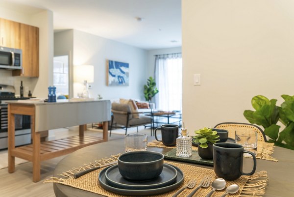 Modern kitchen with stainless steel appliances in The Madison at Marshfield luxury apartments