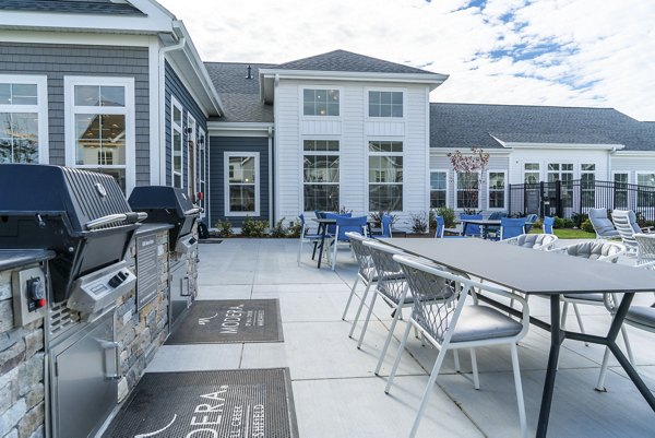 Outdoor patio space with cozy seating at The Madison at Marshfield apartments