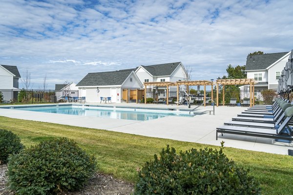 Luxury pool with cabanas at The Madison at Marshfield apartments, perfect for relaxation and leisure