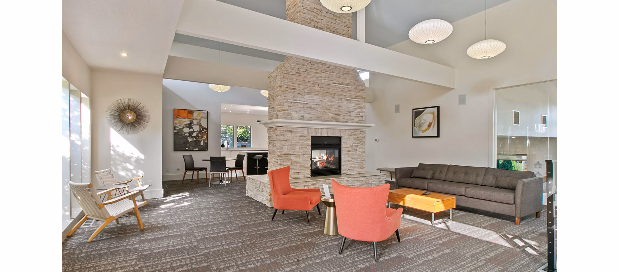 Clubhouse featuring modern design and lounge area at One Jefferson Apartments