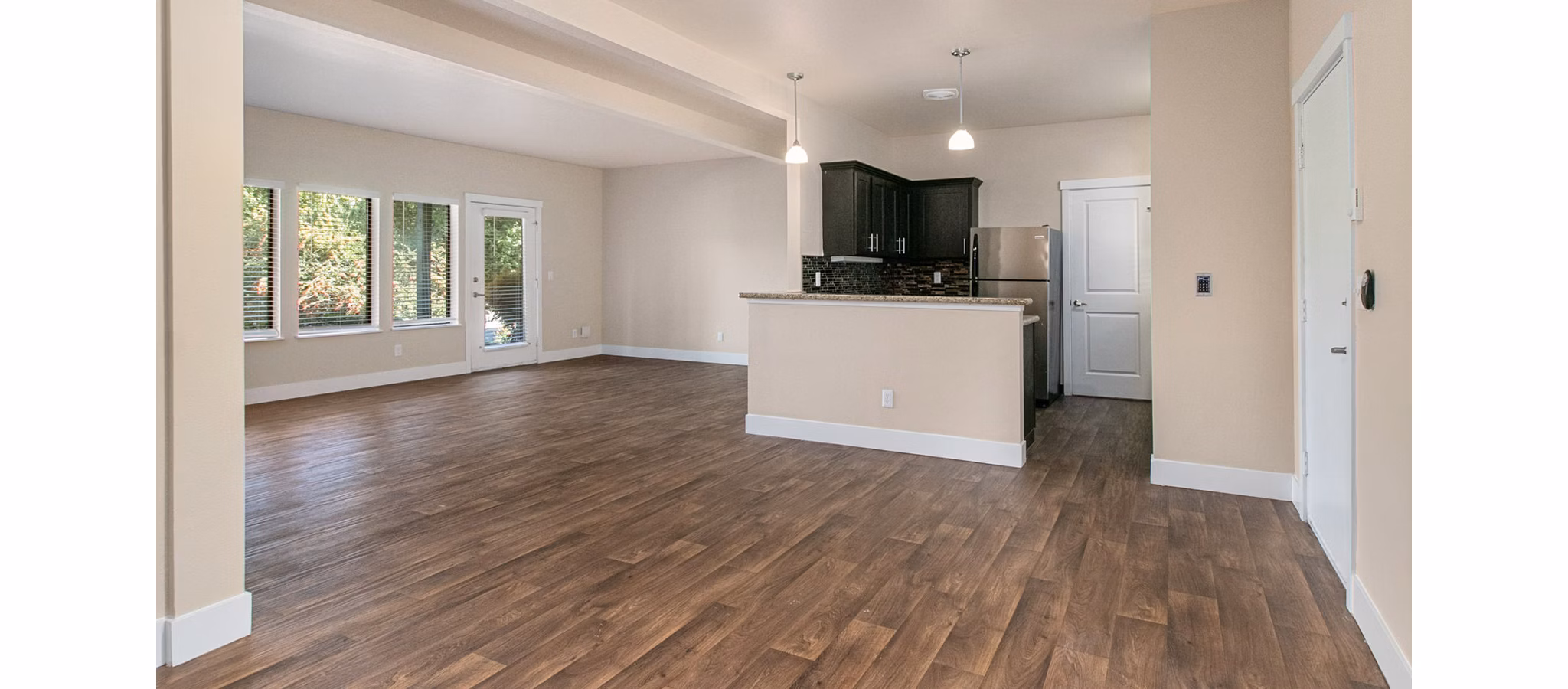 Living room with modern furnishings and natural light at One Jefferson Apartments