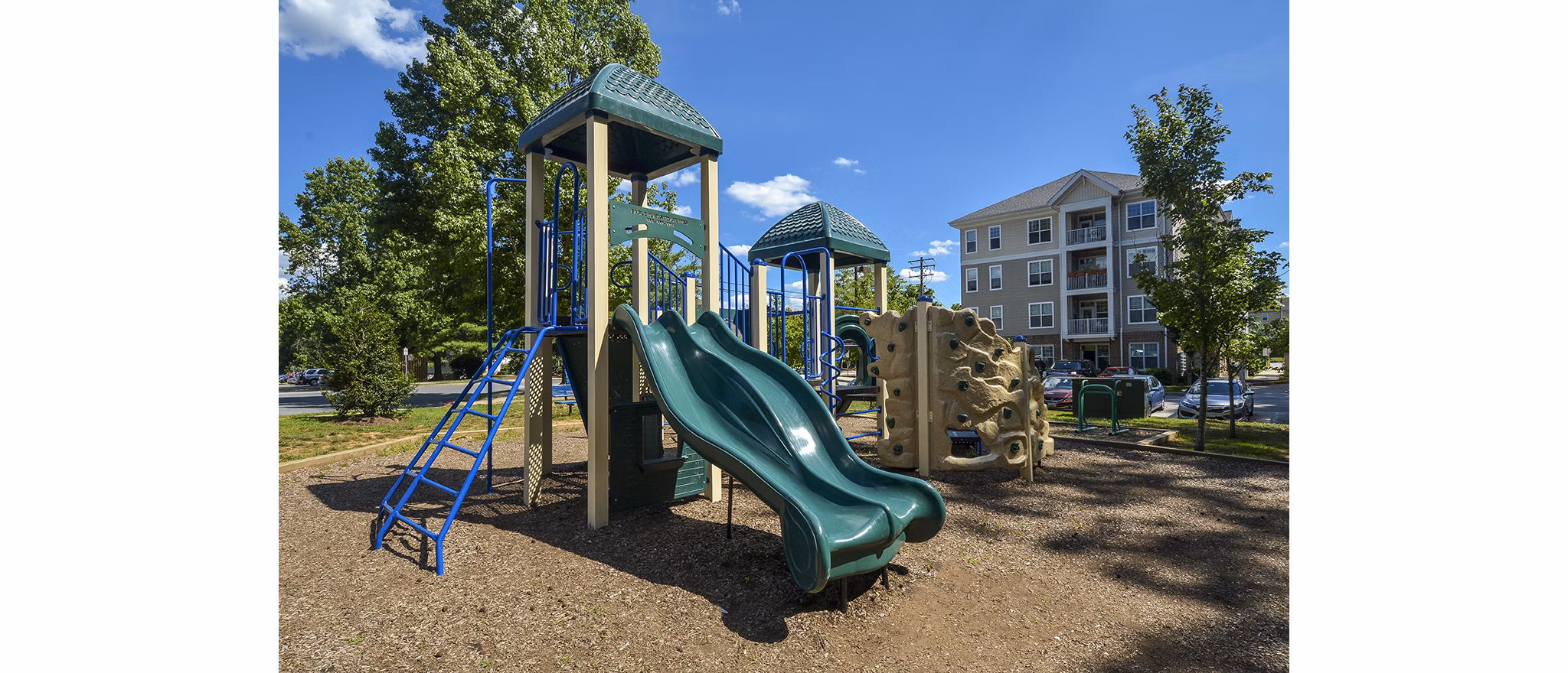 Orchard Park Apartments: Elegant mid-rise building in serene garden setting