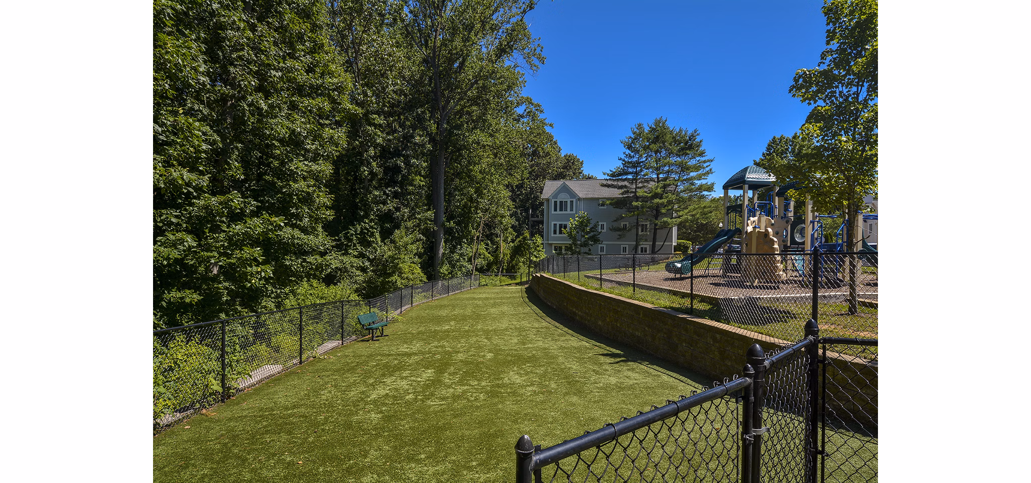 Orchard Park Apartments: Contemporary mid-rise building with lush landscaping in suburban community