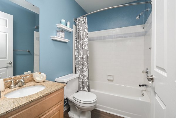 Elegant bathroom with marble countertops and modern fixtures at Orchard Park Apartments