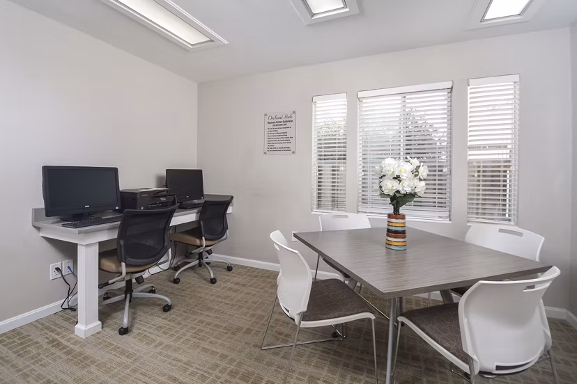 Spacious living room with contemporary decor at Orchard Park Apartments in a Greystar community