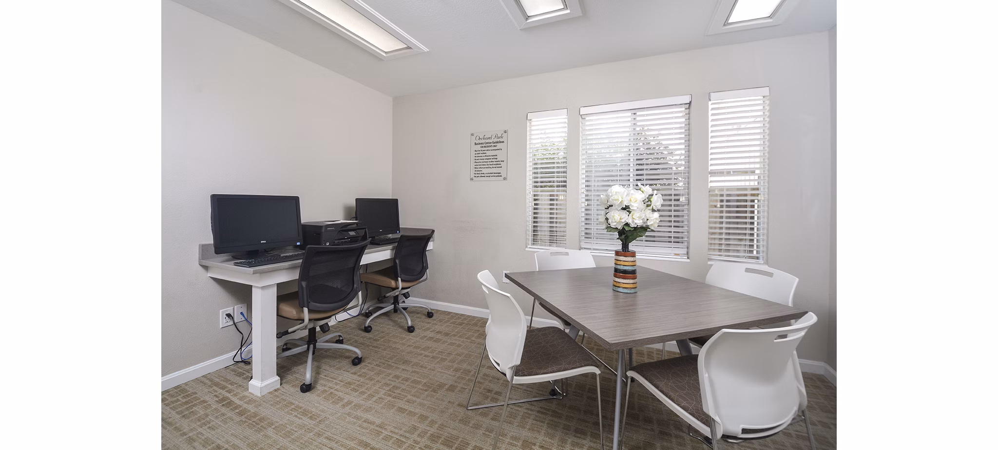 Spacious living room with contemporary decor at Orchard Park Apartments in a Greystar community