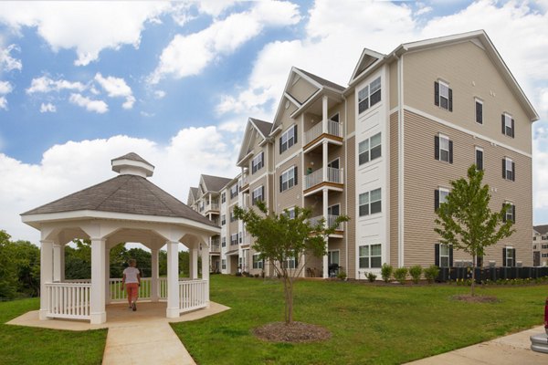 The Park at Walnut Ridge: Elegant facade of luxury apartments surrounded by greenery