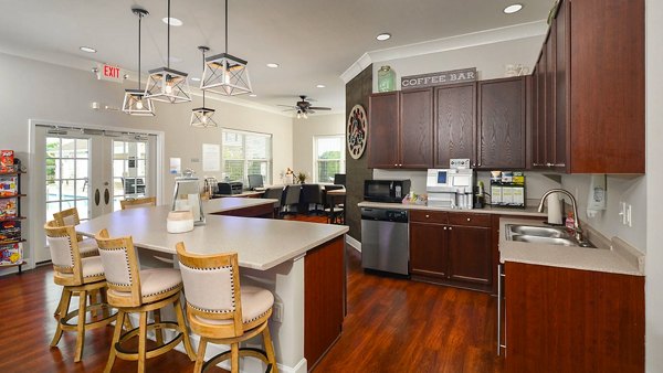 Clubhouse featuring modern lounge space and cozy seating at The Park at Walnut Ridge Apartments
