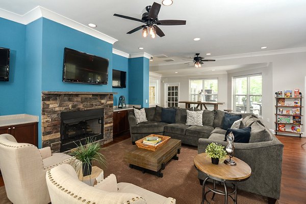 Clubhouse featuring modern furnishings and open spaces at The Park at Walnut Ridge Apartments