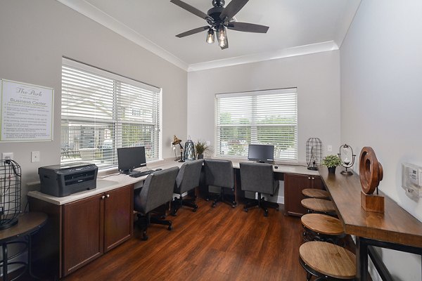 Spacious clubhouse with modern decor at The Park at Walnut Ridge Apartments