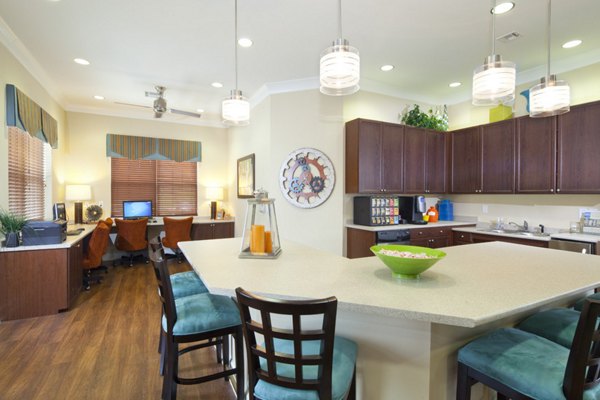 Clubhouse with modern seating and entertainment area at The Park at Walnut Ridge Apartments