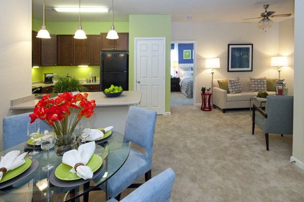 Spacious living room with modern decor and natural light at The Park at Walnut Ridge Apartments