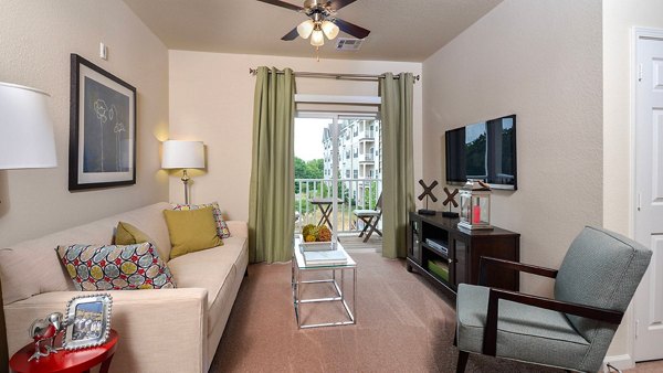 Spacious living room with modern decor at The Park at Walnut Ridge Apartments