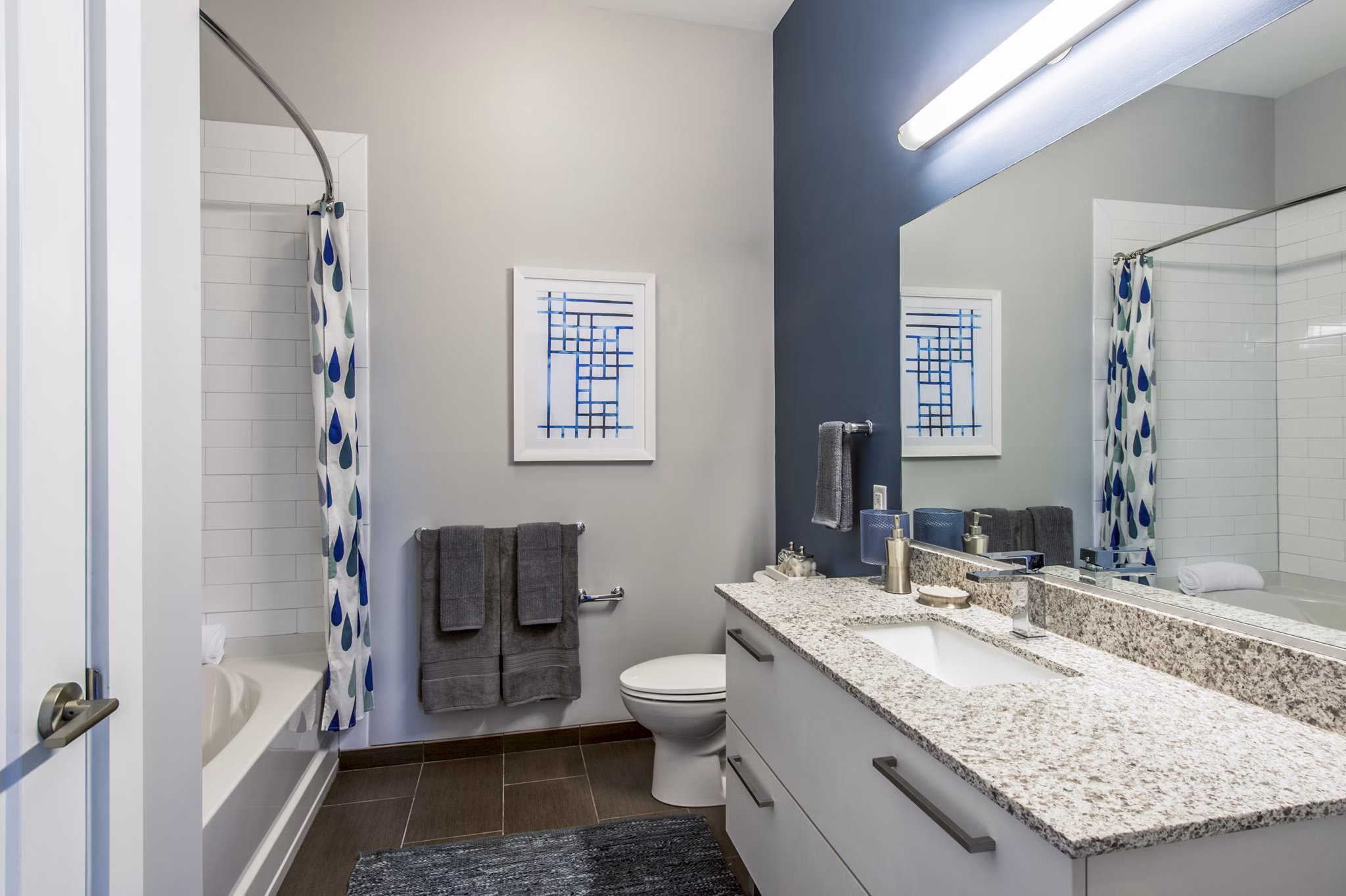 Bathroom featuring sleek fixtures and modern design at Re150 Apartments
