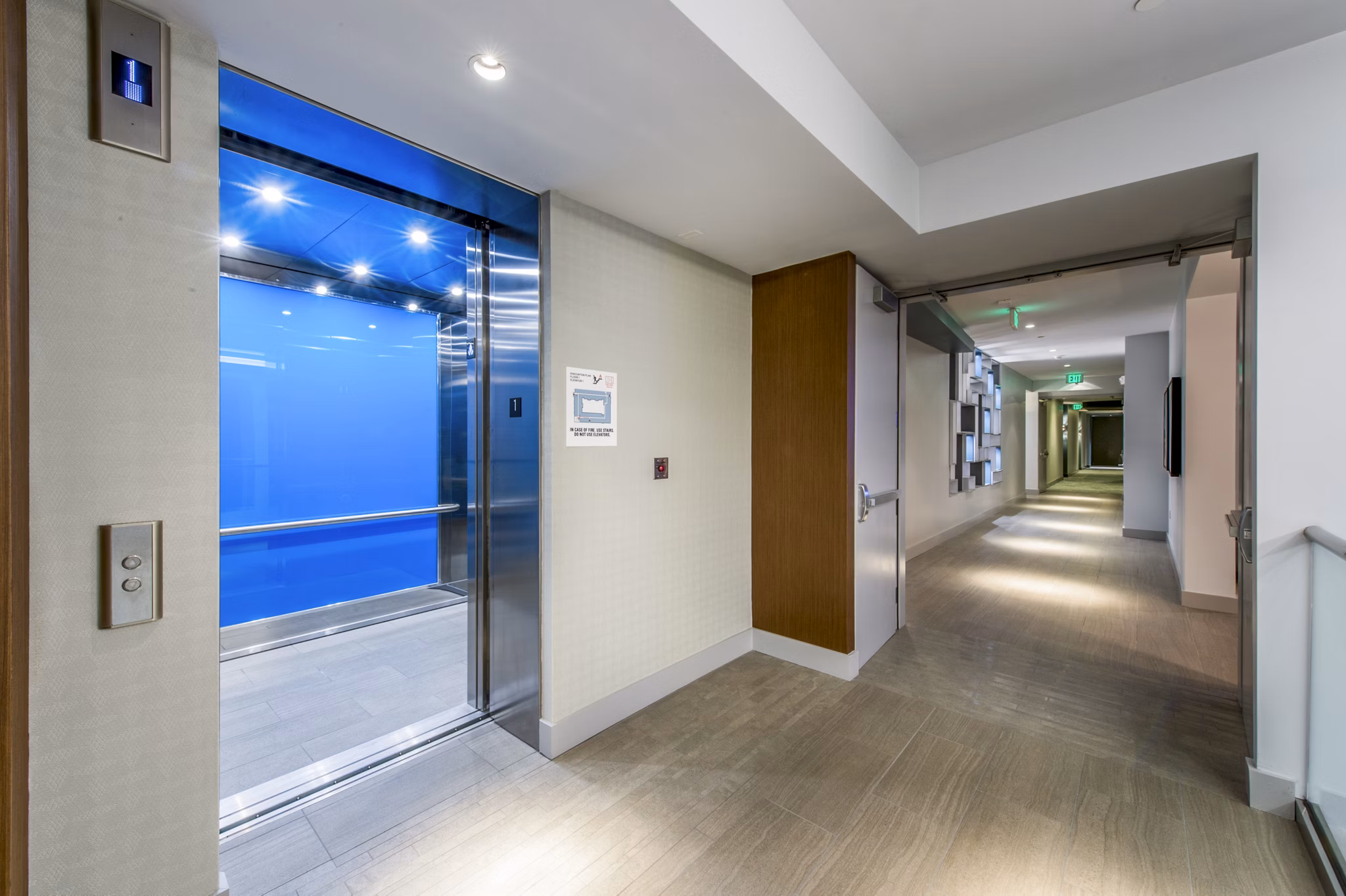 Clubhouse featuring modern lounge seating and communal workspace at Re150 Apartments in a vibrant neighborhood
