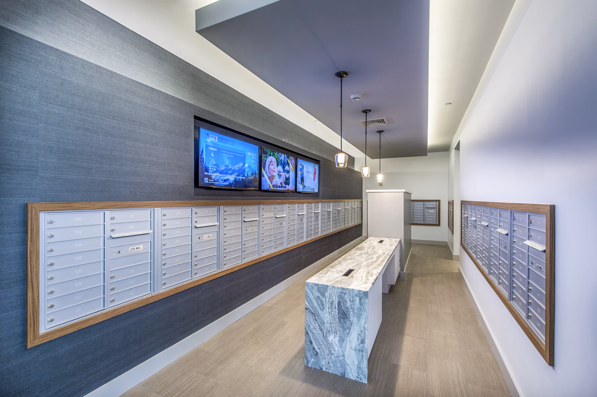 Mail room with organized parcel lockers at Re150 Apartments