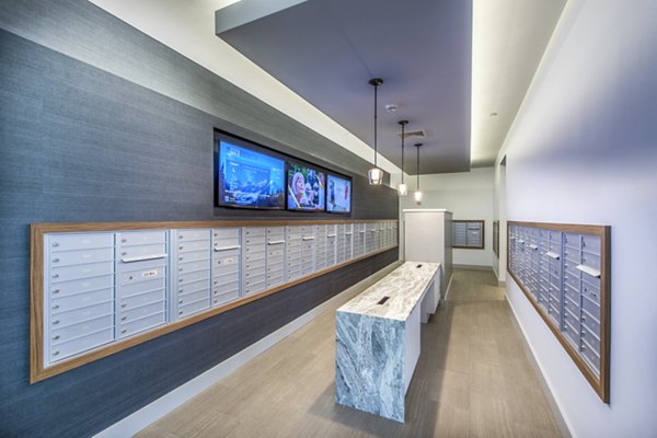 Mail room with organized parcel lockers at Re150 Apartments