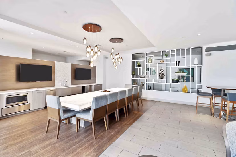 Stylish clubhouse with modern furniture at Re150 Apartments, ideal for social gatherings and community events near luxury apartments