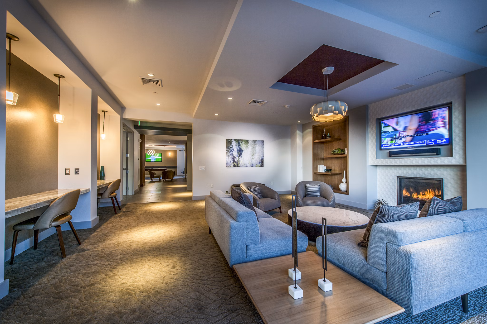 Stylish clubhouse with modern furniture at Re150 Apartments, ideal for social gatherings and community events near luxury apartments