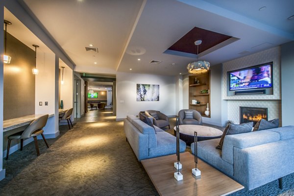 Stylish clubhouse with modern furniture at Re150 Apartments, ideal for social gatherings and community events near luxury apartments