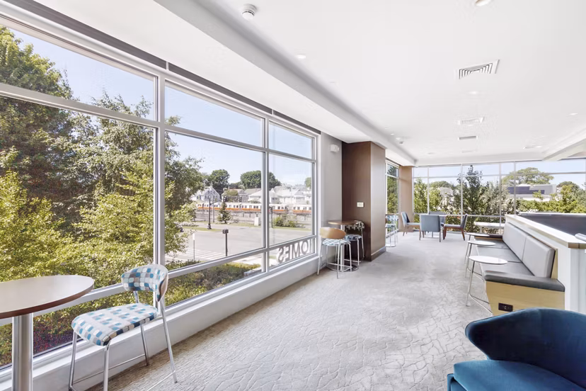 Clubhouse at Re150 Apartments featuring modern design and spacious seating areas, luxury amenities in Cary