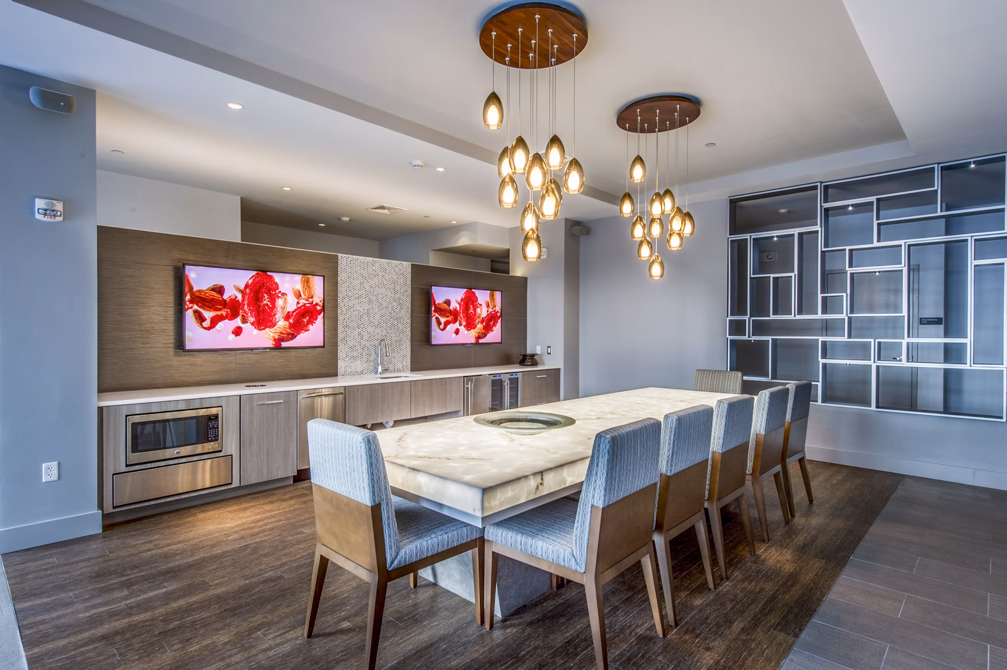 Modern clubhouse with elegant furnishings at Re150 Apartments, perfect for social gatherings and relaxation