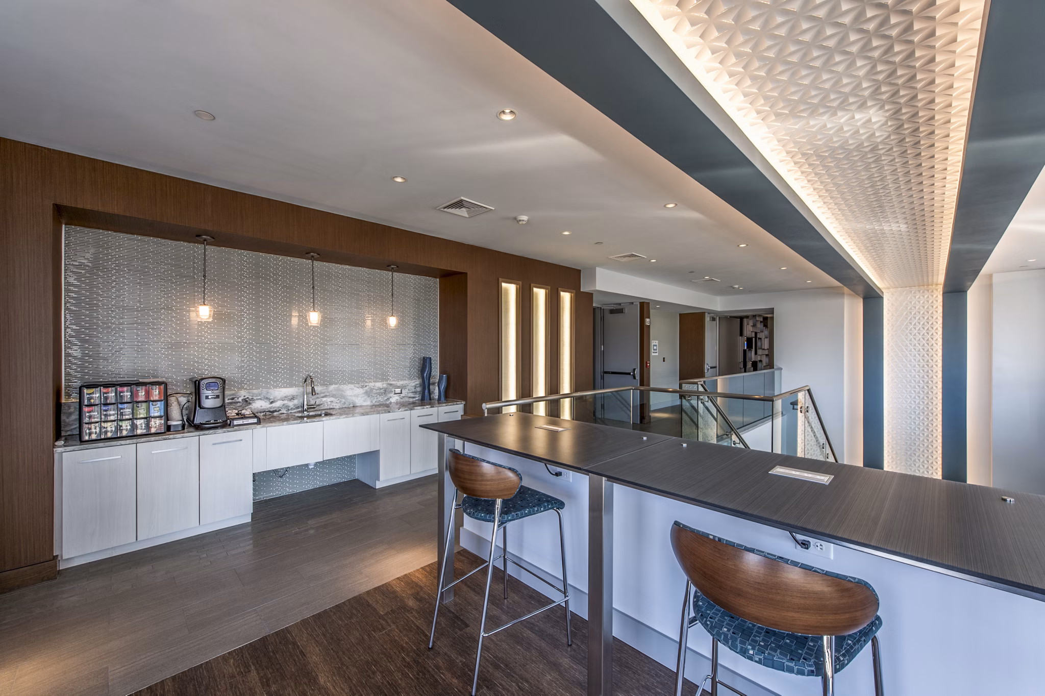 Modern clubhouse featuring social lounge and entertainment areas at Re150 Apartments, a Greystar luxury property