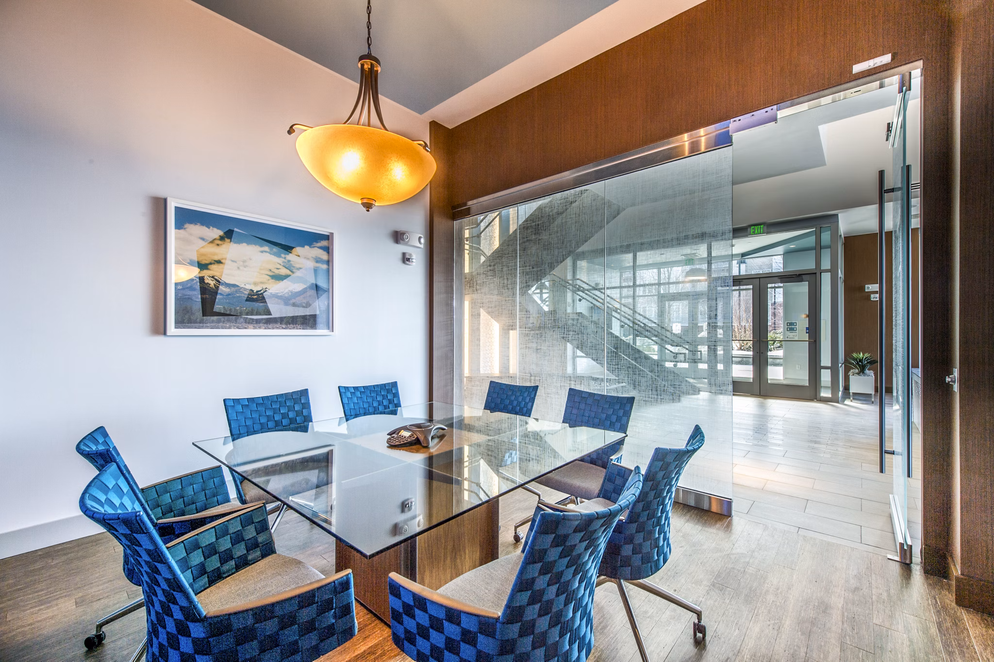 Clubhouse meeting facility featuring modern design and seating at Re150 Apartments, ideal for gatherings and events