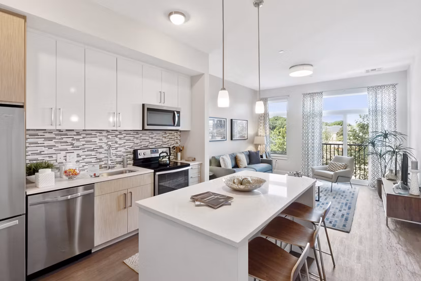 Modern kitchen with stainless steel appliances at Re150 Apartments, a luxury property by Greystar in the heart of Medford