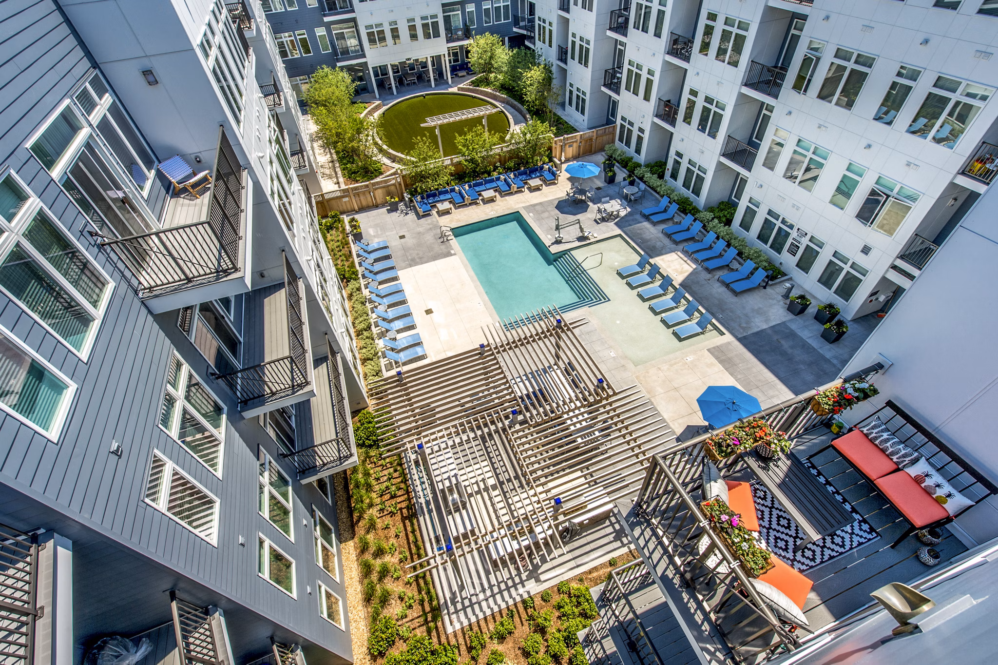 Outdoor pool area showcasing modern design at Re150 Apartments for relaxation and leisure