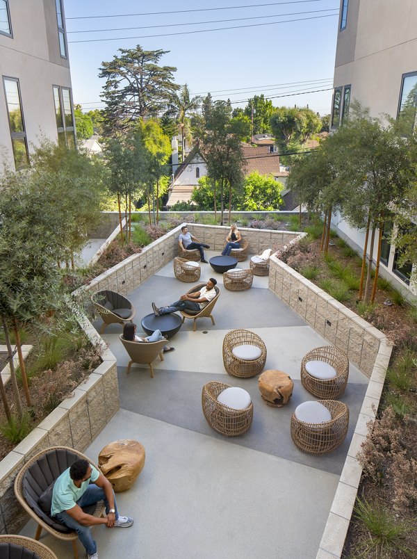 Rinrose Apartments: Modern patio with outdoor seating in a luxury community