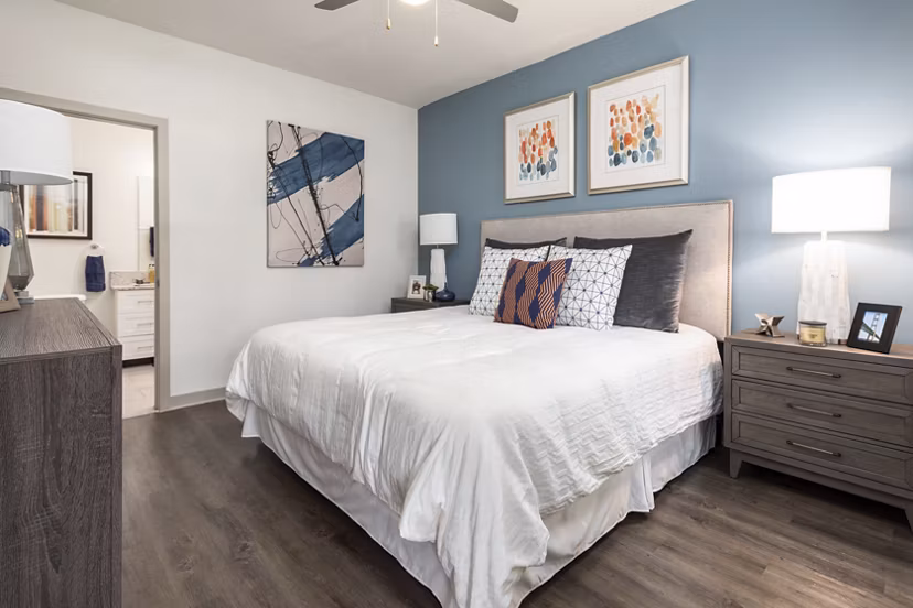 Bedroom featuring modern design and ample natural light at Solara Apartments