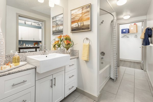 Modern bathroom with sleek fixtures and double vanity at Solara Apartments