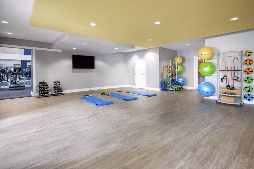 Modern fitness center with state-of-the-art equipment at Solara Apartments, ideal for an active lifestyle in a luxury setting