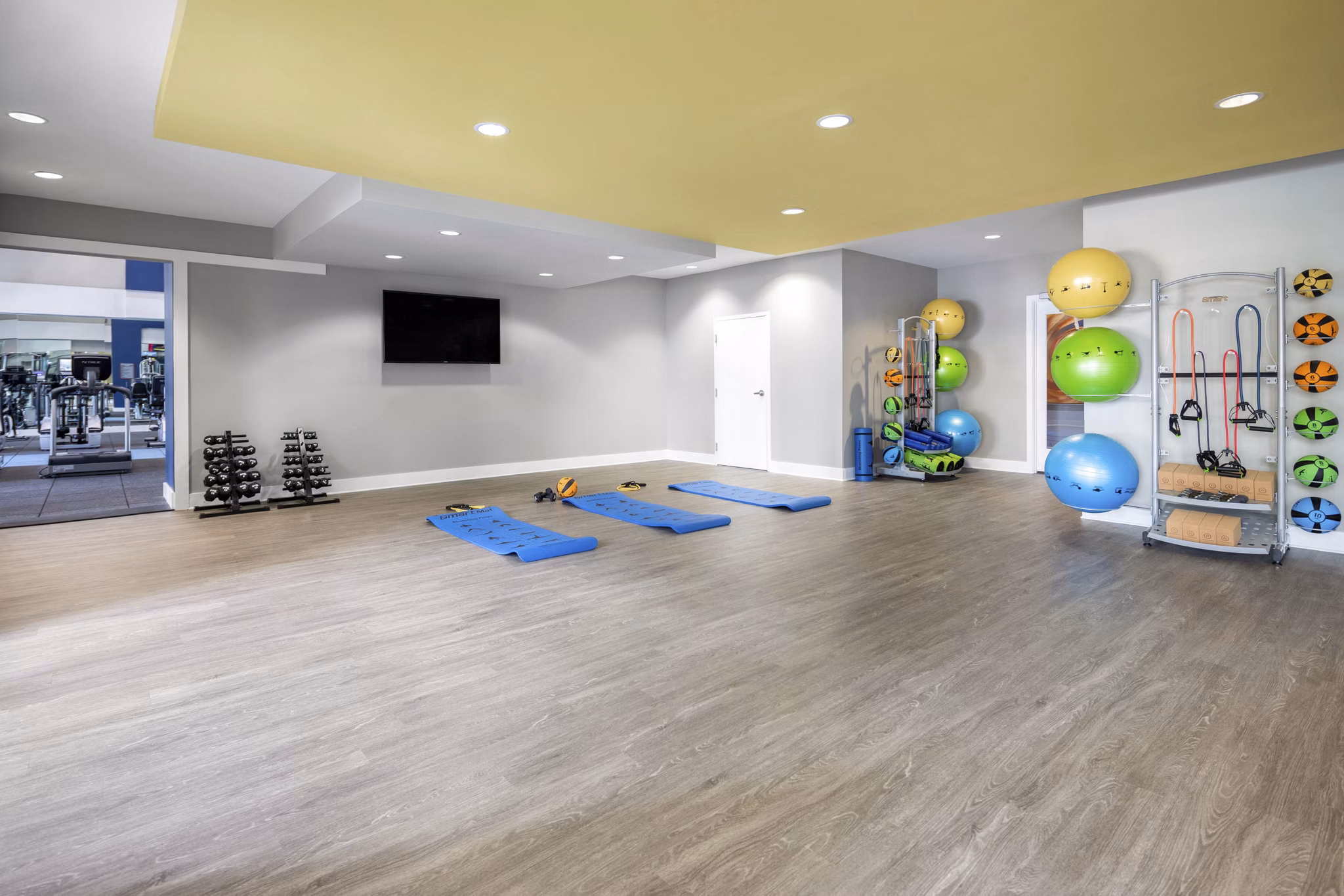 Modern fitness center with state-of-the-art equipment at Solara Apartments, ideal for an active lifestyle in a luxury setting