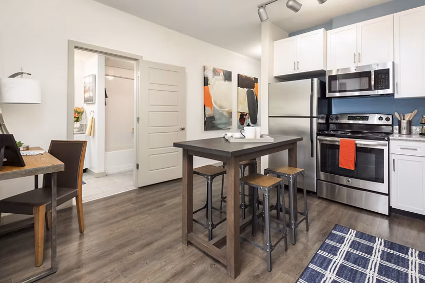 Living room featuring contemporary furniture and large windows in Solara Apartments, offering luxury living experiences