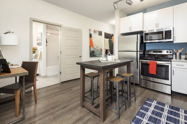 Living room featuring contemporary furniture and large windows in Solara Apartments, offering luxury living experiences