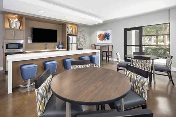 Solara Apartments: Elegant living room with modern decor and ample natural light