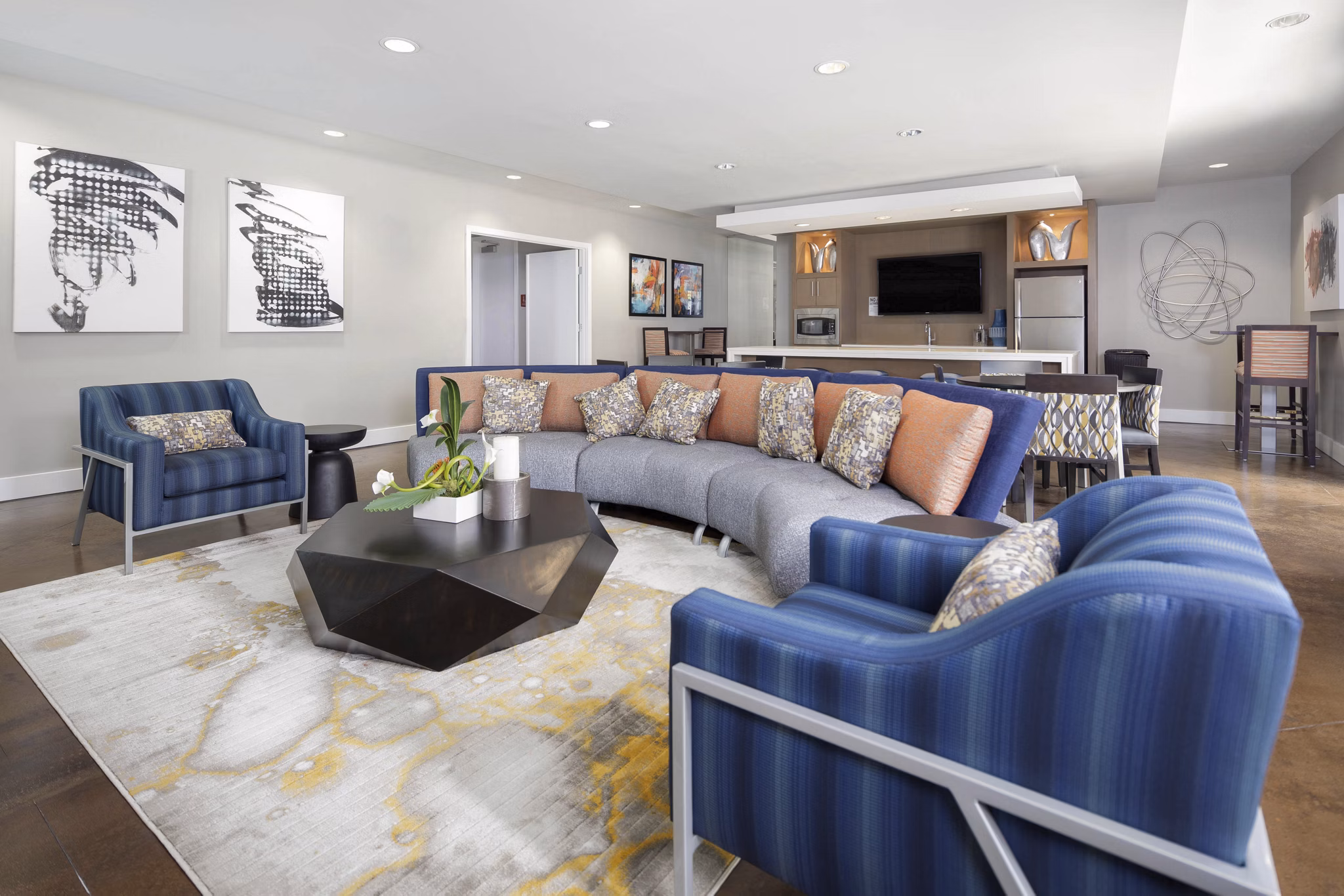 Living room featuring modern decor and natural light at Solara Apartments