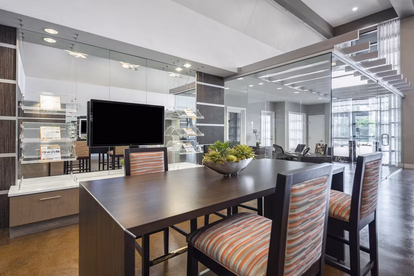 Living room with modern decor and plush seating in Solara Apartments, a Greystar luxury property