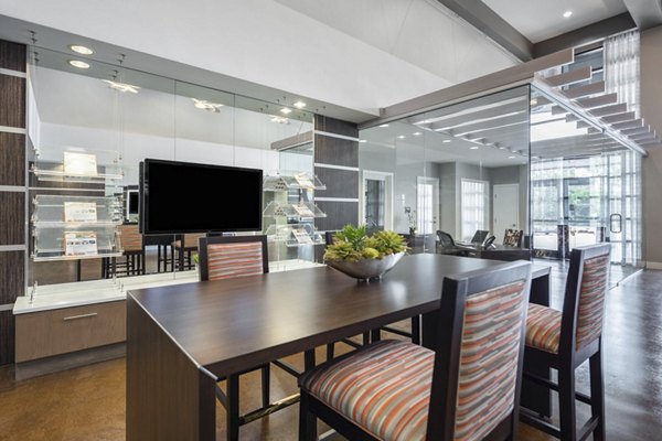 Living room with modern decor and plush seating in Solara Apartments, a Greystar luxury property