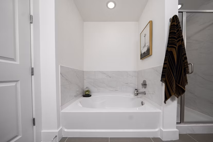 Bathroom featuring modern fixtures and elegant design at Tens on West Apartments