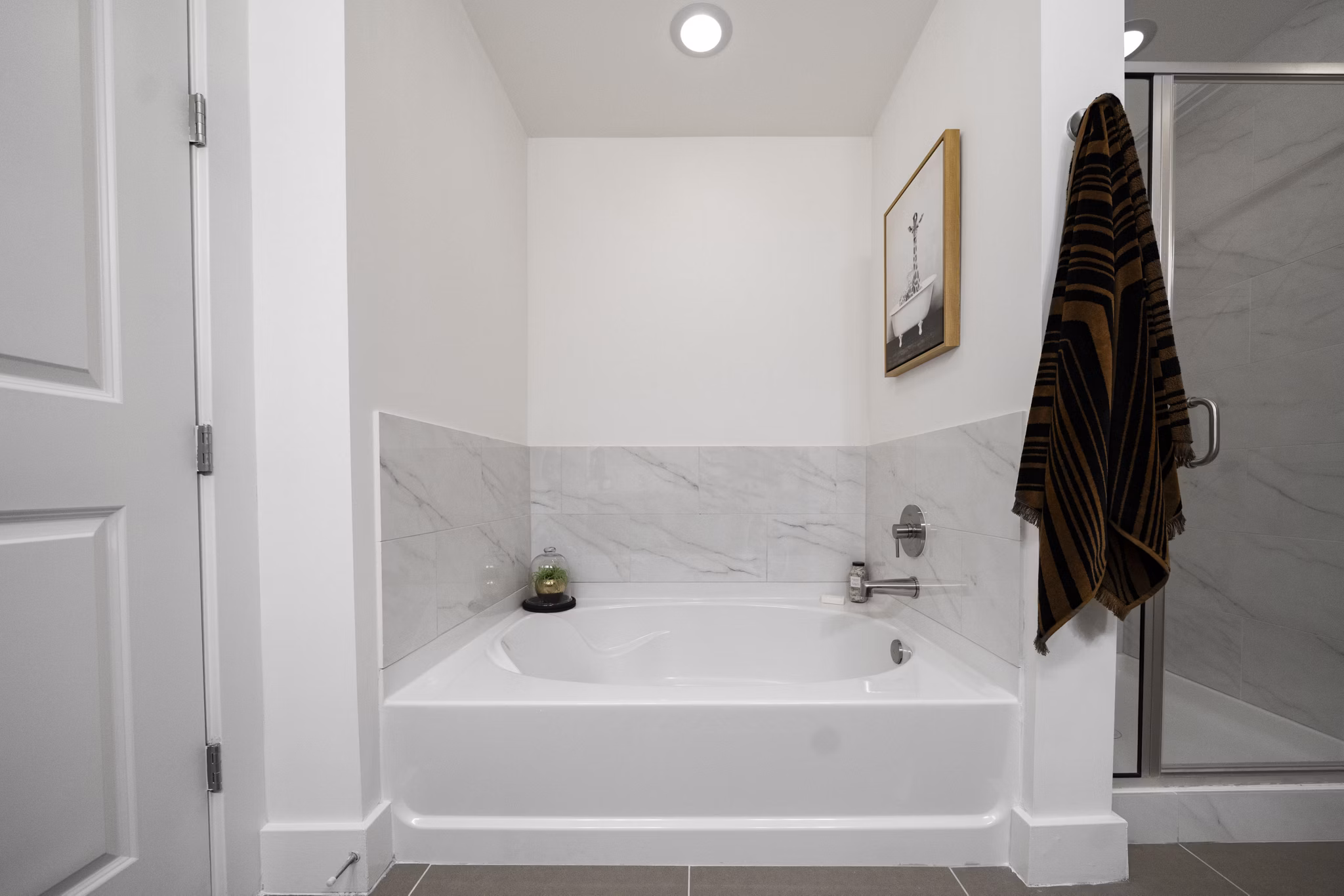 Bathroom featuring modern fixtures and elegant design at Tens on West Apartments