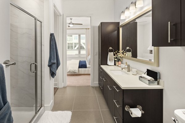 Bathroom featuring modern fixtures and sleek design at Tens on West Apartments, a luxury living space by Greystar