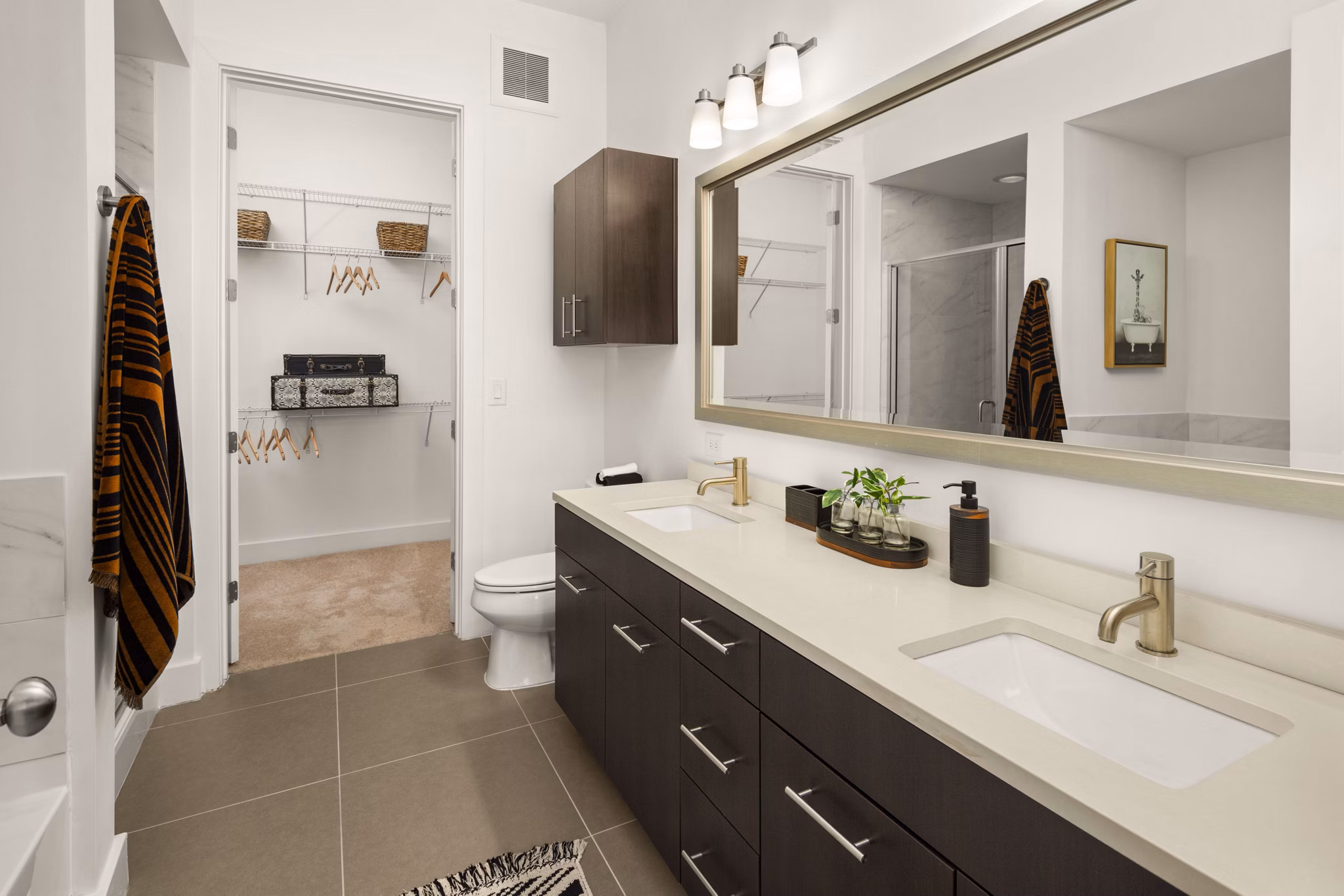 Luxury bathroom with elegant fixtures at Tens on West Apartments