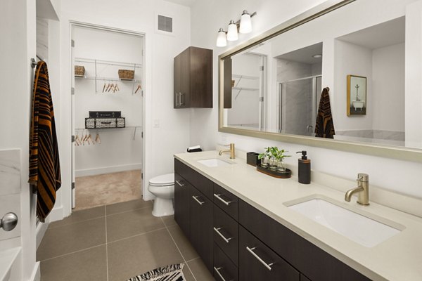 Luxury bathroom with elegant fixtures at Tens on West Apartments