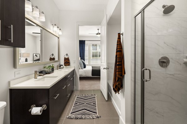 Elegant bathroom with modern fixtures at Tens on West Apartments in the heart of a vibrant community
