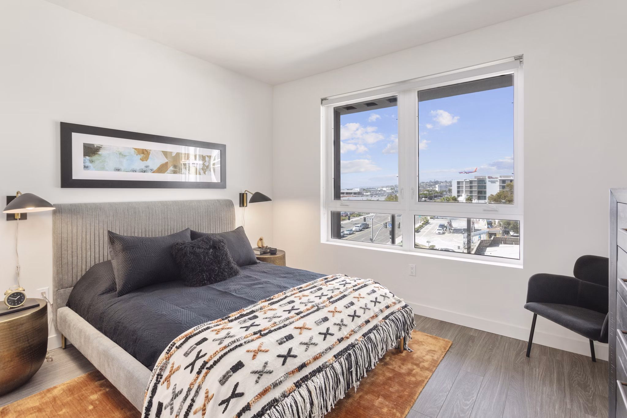 Inviting bedroom with modern decor and ample natural light at Valentina by Alta Apartments