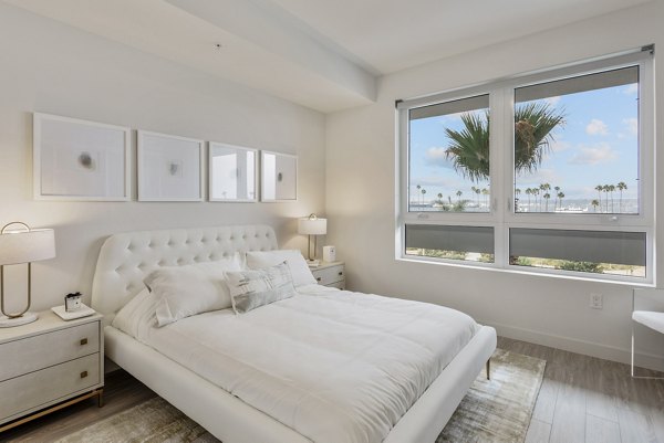 Valentina by Alta Apartments: Modern bedroom with cozy interior design and city views in luxury housing community