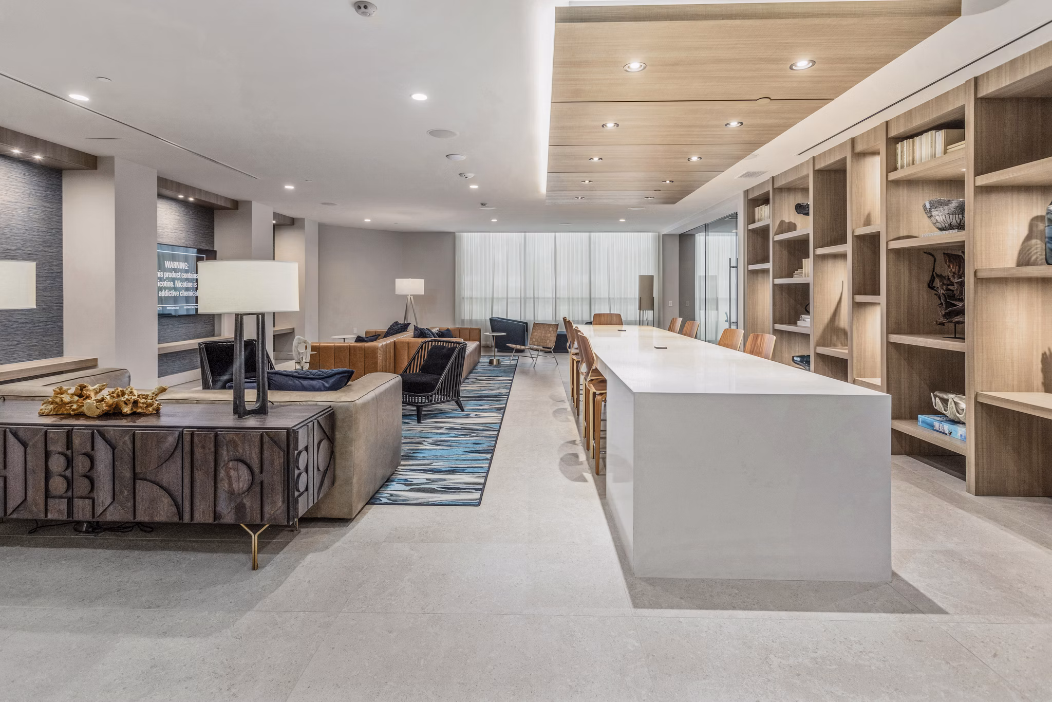 Clubhouse with modern decor and lounge seating at Valentina by Alta Apartments